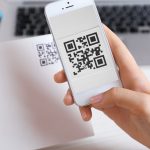 Scanning a QR code on a piece of direct mail